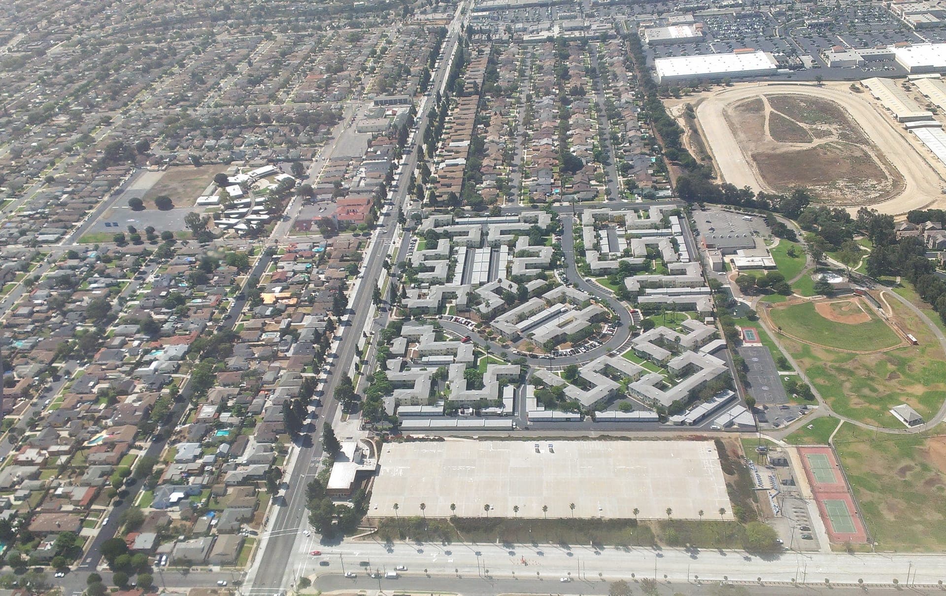 A garden-style apartment complex exterior, daytime